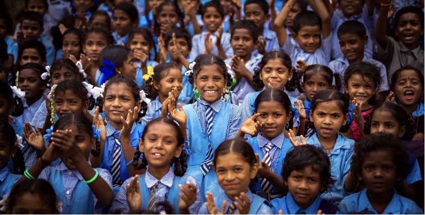 Group of school children in blue uniforms
